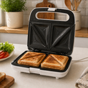 Sandwichera Dominion Blanca D5011W - Placas Antiadherentes, Sellado Rápido y Diseño Compacto para Cocina Hogareña o de Oficina